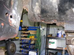 Cut out rust and rail near battery tray
