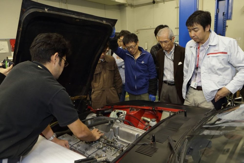 nissan-restoration-club-safari-rally-z-members-tinkering-under-hood (1).jpg